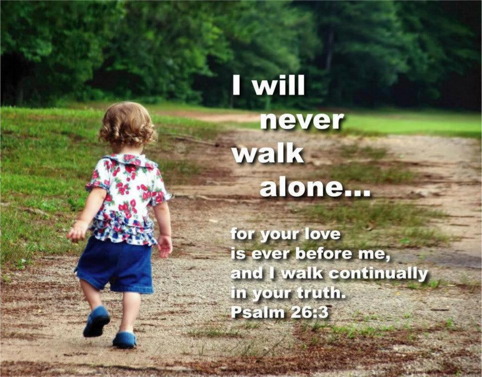 Child walking away on a dirt path in a park; overlay reads: 'I will never walk alone... for your love is ever before me, and I walk continually in your truth. Psalm 26:3'